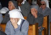 Catholic sisters react during the funeral of late Sister Leonella at the Consolata Shrine in Nairobi, Kenya, on Thursday, Sept 21, 2006.  Sister Leonella was killed in Somalia last Sunday by gunmen. (AP Photo/Sayyid Azim)